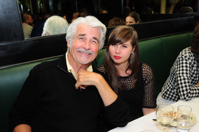 James Brolin wearing a black zipped turtle neck and Molly wearing a black fishnet top with a black inner top.